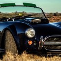 091 FacebookHeader AUS NT 2004MAY21 AliceSprings 004  During one of my visits back to Alice Springs, Geoff & Liz Roe lent me their AC Shelby Cobra replica to put in front of my lens.    I've got to say that that this mechanical missile was scary quick to drive, but a whole lot of fun, none the less.    Hmmmm ..... 10 years on, and I think my photo still holds up pretty well. — in Alice Springs, Northern Territory, Australia