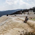 316 FacebookHeader MEX OAX SanLorenzoAlbarradas 2019APR04 HierveElAgua 007  One of the more unique spots I've visited the natural springs and petrified waterfalls of Hierve el Agua, located about 70 km east of Oaxaca in Mexico.    The larger of the two measures about ninety metres wide and falls eighty metres to the valley floor.    The thing that makes this place so unique is that the falls are formed by relatively small amounts of water, which are oversaturated with calcium carbonate, giving the formations a white or near white appearance and comes to the surface through cracks or fissures on the mountainside. As the water slowly drips down the rock face, it forms large stalactites similar to those found in caves with the effect of what you see here. — @ Hierve el Agua, Oaxaca, Mexico : - DATE, - PLACES, - TRIPS, 10's, 2019, 2019 - Taco's & Toucan's, Americas, April, Day, Hierve el Agua, Mexico, Month, North America, Oaxaca, San Lorenzo Albarradas, South Pacific Coast, Thursday, Year