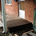 USA ID Boise 7011WAshland EHF Porch 2004JUL10 002  Ripping the carpet of found it was glued to 2x6's bolted to the concreted slab. : 2004, 7011 West Ashland, Americas, Boise, Idaho, July, North America, Porch, USA