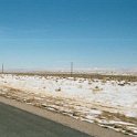 USA WY WalcottJunction 2002MAR03 002  We'd get the occasional little drifts across the road though. : 2002, 2002 - Booze Bothers Tour, Americas, March, North America, USA, Walcott Junction, Wyoming