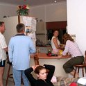 AUS NT AliceSprings 2004MAY18 002  Fluxy, Gav and Bruhnsie doing what most husbands do best - standing around the kitchen watching the women working. : 2004, 2004 - The "Get Fluxed" Australian Tour, Alice Springs, Australia, Date, May, Month, NT, Places, Trips, Year