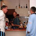 AUS NT AliceSprings 2004MAY18 005  Fluxy, Gav and Bruhnsie doing what most husbands do best - standing around the kitchen watching the women working. : 2004, 2004 - The "Get Fluxed" Australian Tour, Alice Springs, Australia, Date, May, Month, NT, Places, Trips, Year