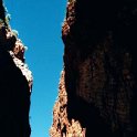 AUS NT StandleyChasm 2001JUL11 009  The result of time and erosion is a deep red cleft crowded on either side by craggy slopes that rise 80 metres (260 feet) straight up. : 2001, 2001 The "Gruesome Twosome" Australian Tour, Australia, Date, July, Month, NT, Places, Standley Chasm, Trips, Western MacDonnells, Year