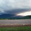 AUS QLD Cairns 2001JUL16 BruceHighway 002  The sun trying to force it's way through the rain clouds we spectacular. : 2001, 2001 The "Gruesome Twosome" Australian Tour, Australia, Cairns, Date, July, Month, Places, QLD, Trips, Year