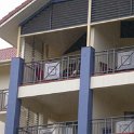 AUS QLD Cairns 2003APR20 Apartment 002  That's them, sitting up there on the balcony over looking Cairns harbour sipping Malibu and pineapple juice 10 o'clock Sunday morning. : 2003, April, Australia, Cairns, Date, Events, Flux - Trevor & Sonia, Month, Places, QLD, Wedding, Year