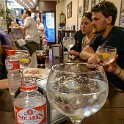 EU ESP MAD Madrid 2017JUL18 003  We wandered down one of the numerous little side streets and happened upon   Cafe Iris   in which they serve brilliant Gin &amp; Tonic's in bird bath size glasses. I tried two, one with fresh grapefruit and the other with fresh pomegranate and whilst an unusual combination, it was both refreshing and smooth in drinking - great combos.   How's this for a 3 Euro Gin & Tonic. Yes - that is a 500 ml bottle of water next to it. : 2017, 2017 - EurAisa, DAY, Europe, July, Southern Europe, Spain, Tuesday
