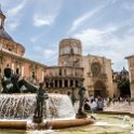 EU ESP VAL Valencia 2017JUL19 PlacaDeLaVerge 002  The plaza consists of centrally located depiction of Neptune - the   Fuente del Turia   ( Turia Fountain ), which is flanked on three sides by some of València's most emblematic buildings - the   Cathedral of Santa Maria   (  Cathedral–Basilica of the Assumption of Our Lady of Valencia ), the   Basílica de la Virgen de los Desamparados   ( Our Lady of the Abandoned ) and the   Palau de la Generalitat   ( Palace of the Generalitat ). : 2017, 2017 - EurAisa, DAY, Europe, July, Plaça de la Verge, Southern Europe, Spain, Turia Fountain, València, Valèncian Community, Wednesday